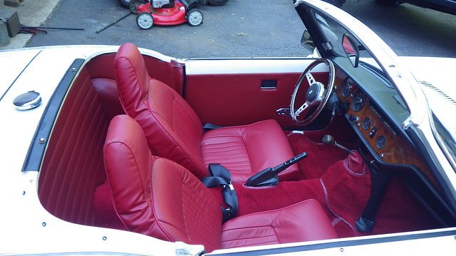 Red leather interior and wood dash of a 1972 Triumph Spitfire Mk IV